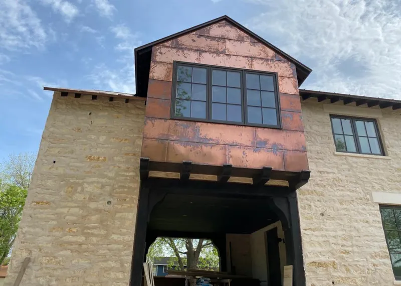 Copper metal panel facade on a stone building for Skylight Installation in Jupiter